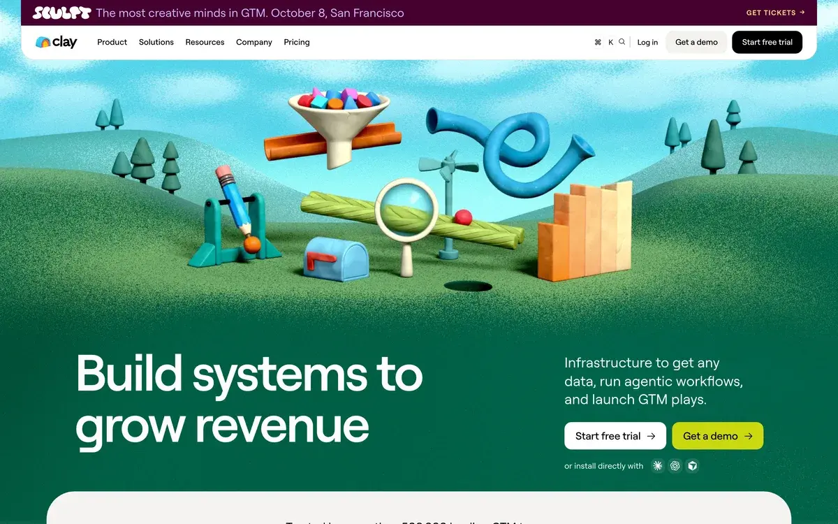 Clay's homepage in October 2026, with a 3D illustration of a playful machine of funnels, a seesaw and a mailbox under the headline Build systems to grow revenue, Start free trial and Get a demo buttons, and a banner for Clay's Sculpt event on October 8 in San Francisco