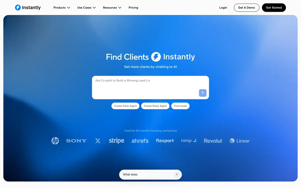 Instantly's homepage in October 2026, a blue gradient panel with the headline Find Clients Instantly and the line Get more clients by chatting to AI, a prompt box with shortcuts to create a sales agent, create a reply agent or find leads, and logos of companies such as HP, Sony, Stripe and Ahrefs