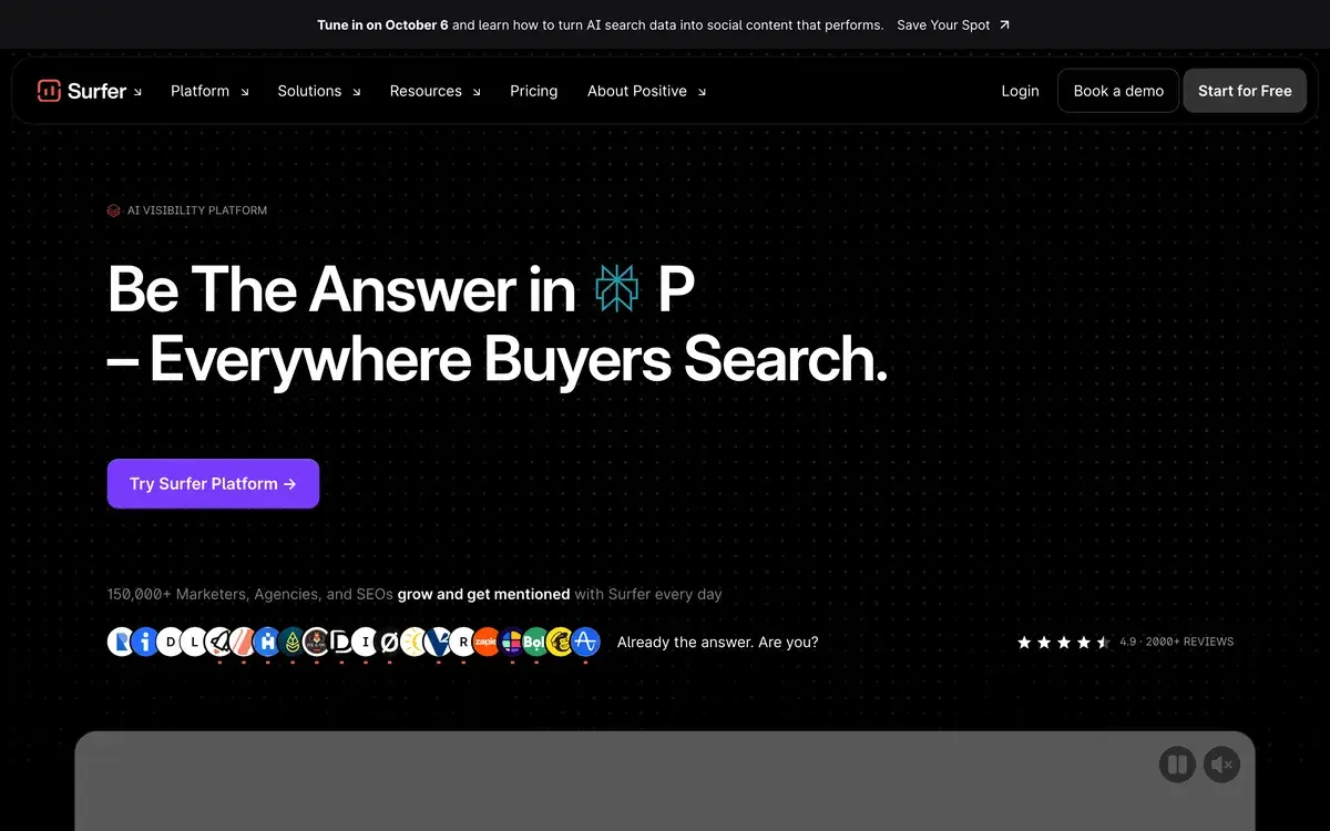 Surfer's homepage in October 2026 on a black background, headed Be The Answer Everywhere Buyers Search with a rotating AI assistant icon, a Try Surfer Platform button and a row of customer logos with a 4.9 rating from 2,000 reviews